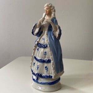 Vintage Elegant Blue and White Porcelain Figurine with Gold accents